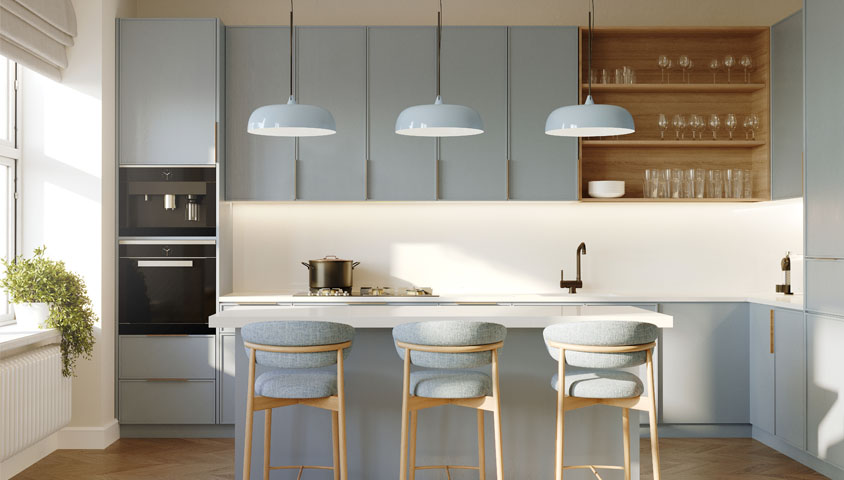Luxury kitchen with light blue cabinetry and a central kitchen island with bench chairs. Centered next to a large window with natural light.