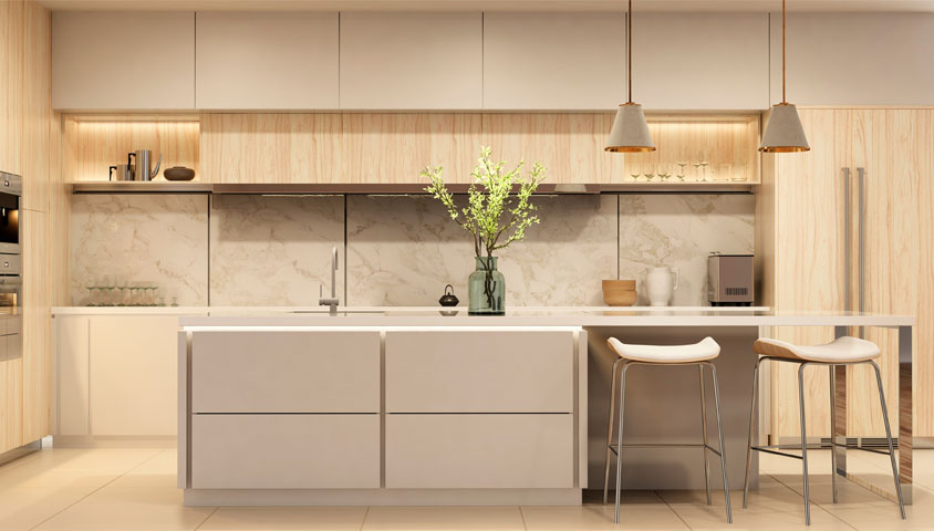A luxurious renovated kitchen with gold accents and white leather. Includes a central kitchen island and wooden cabinetry.