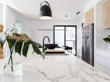 A white marble kitchen countertop inside of a luxury kitchen in Perth that has undergone a custom kitchen renovation.